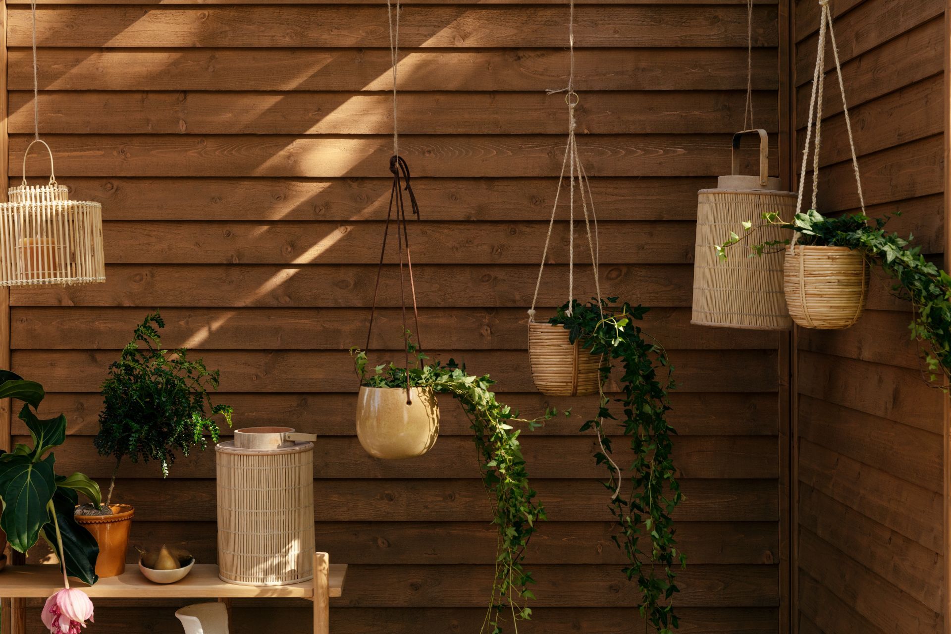 natural colour wooden panel wall and flower pots