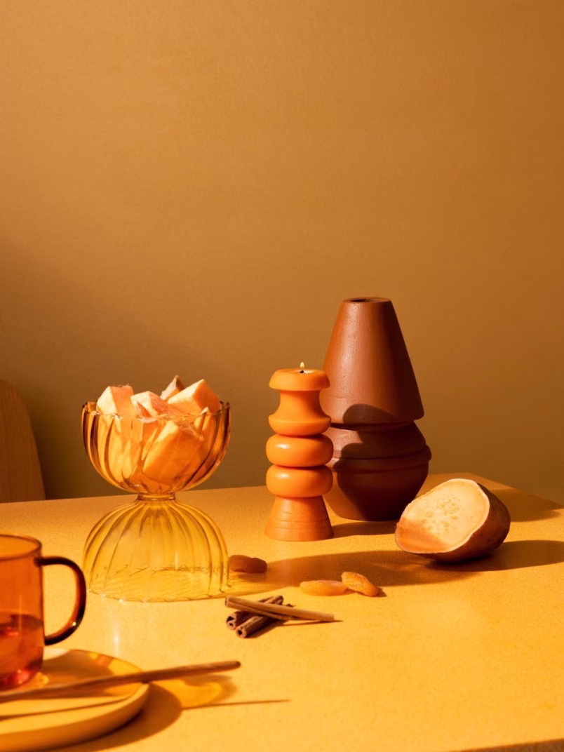 festival dinner table with warm orange yellow wall background