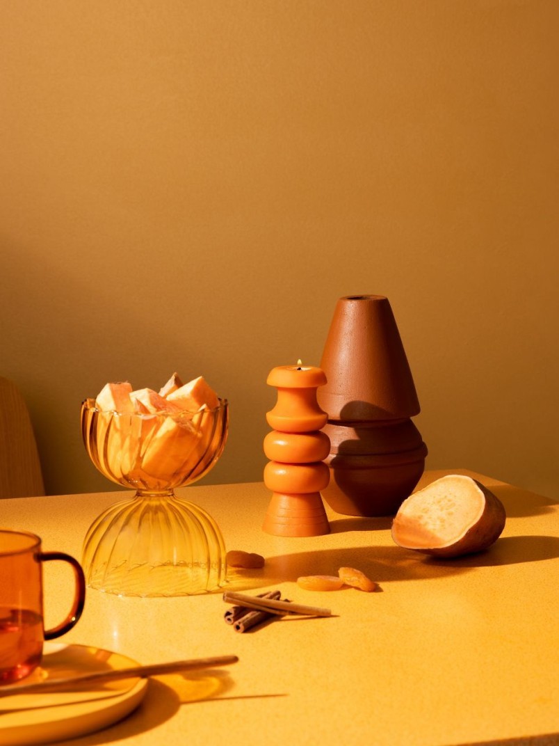 festival dinner table with warm orange yellow wall background