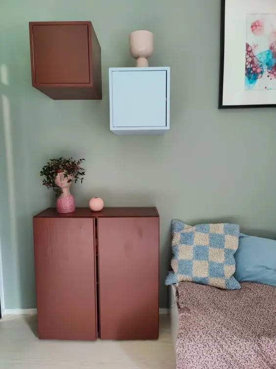 bedroom with colourful cabinet