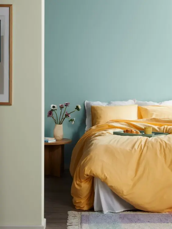 Green painted bedroom wall