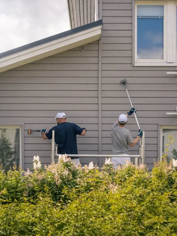 Painters painting exterior wall