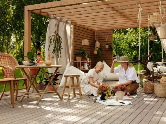 family pergola decorated with neutral colour and plants