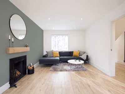living room with green accent wall