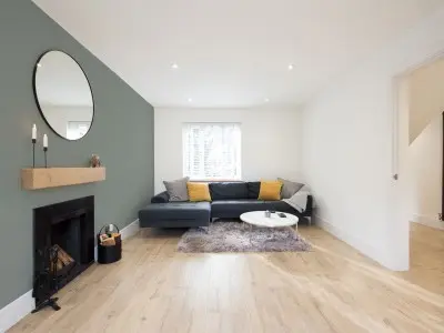living room with green accent wall