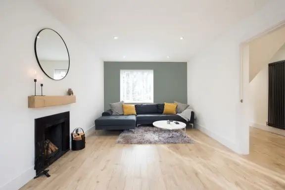 living room with accent wall on the back