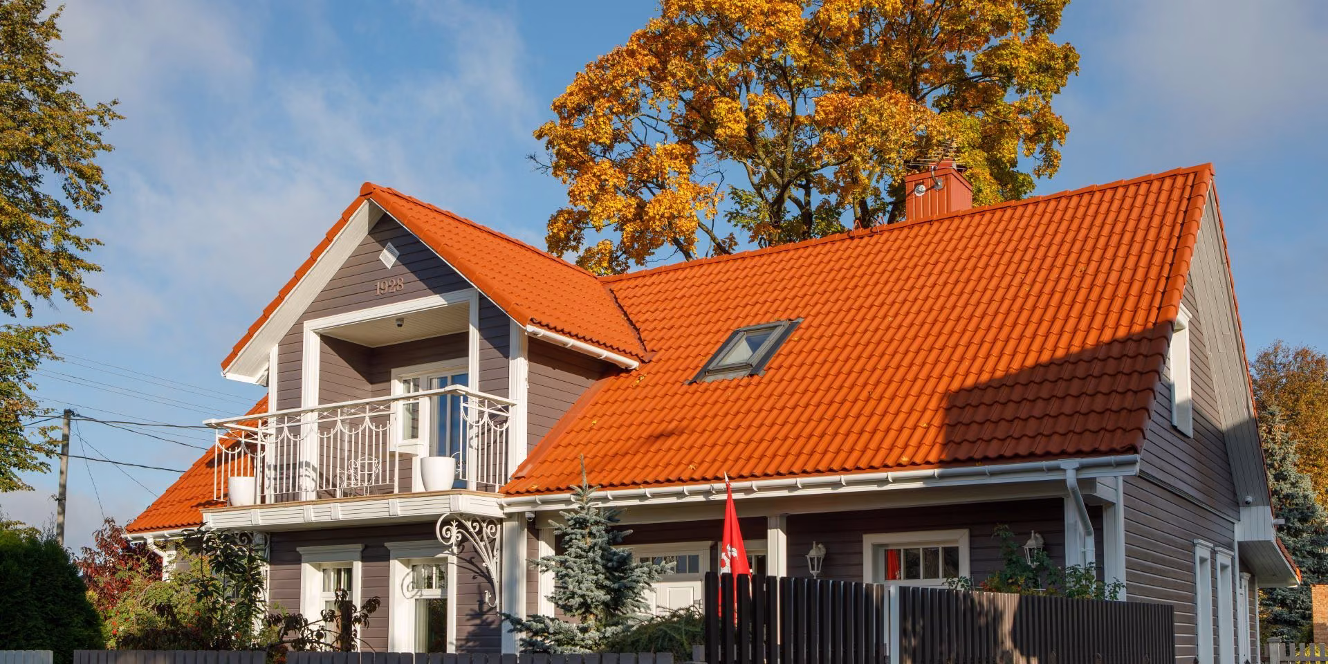 Roof and wooden façade repainting makes house look as good as new