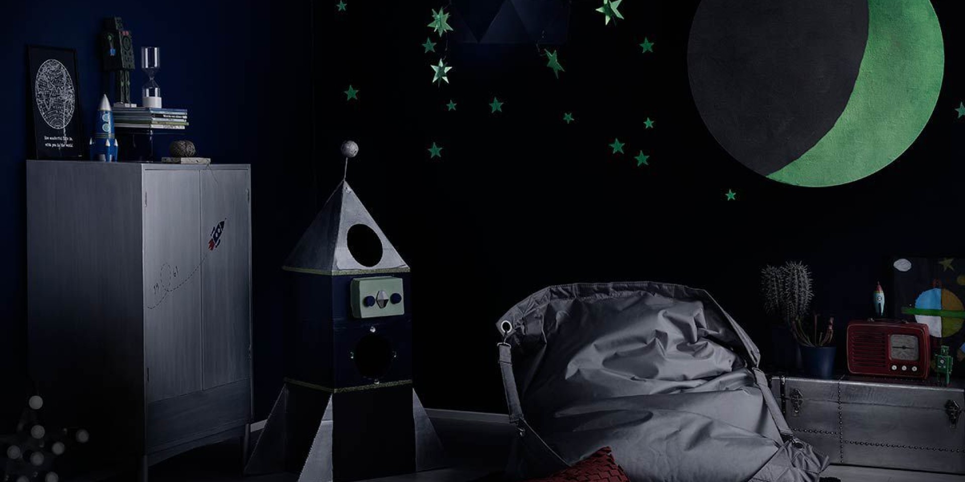 kids room blue wall with glow in the dark moon and stars