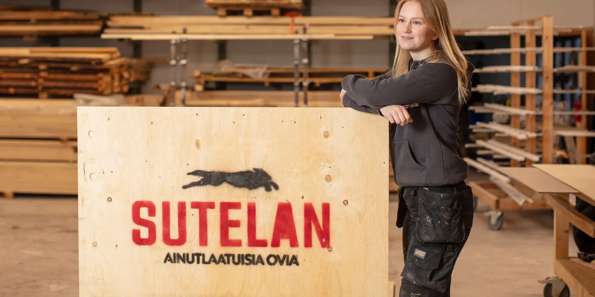Girl standing next to a wooden box