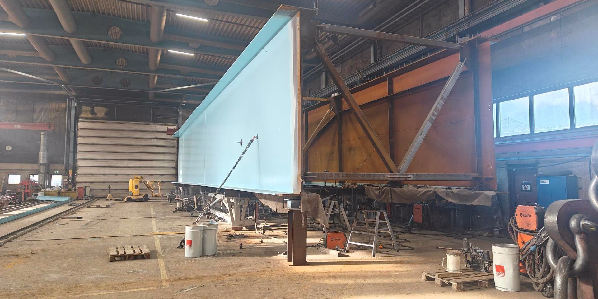 Bridge elements are being painted indoors
