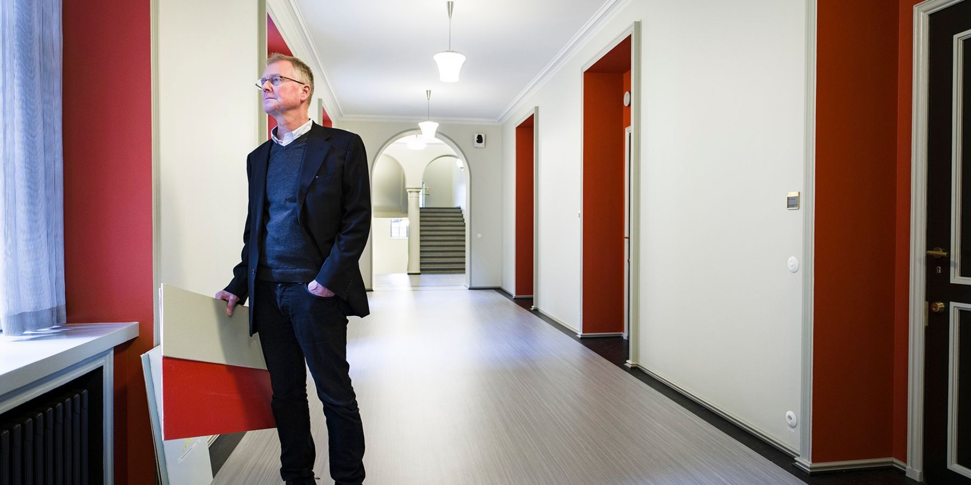 Architect Peter Verhe, the main designer of the refurbishment of the Parliament House, in the repainted corridor of the third floor of the main building.