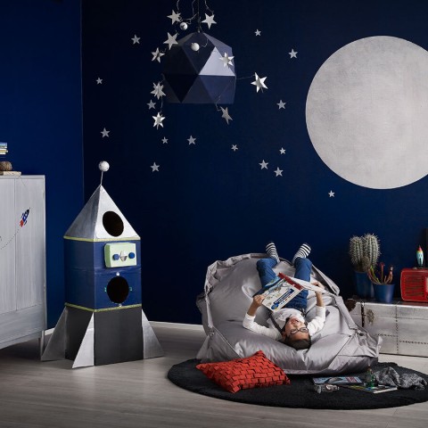kids room with blue wall and painted with silver moon