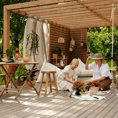 family pergola decorated with neutral colour and plants