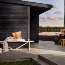 Dark wooden house with terrace
