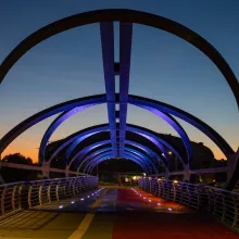 Smart and colourful pedestrian bridge attracts attention with its futuristic form