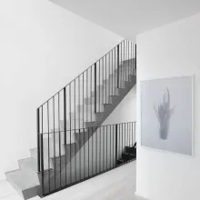 How do paints and coatings affect indoor air quality in green buildings?