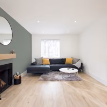 living room with green accent wall
