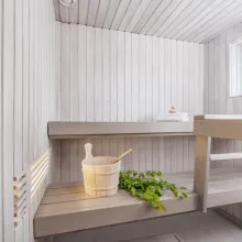white colour sauna with light grey bench