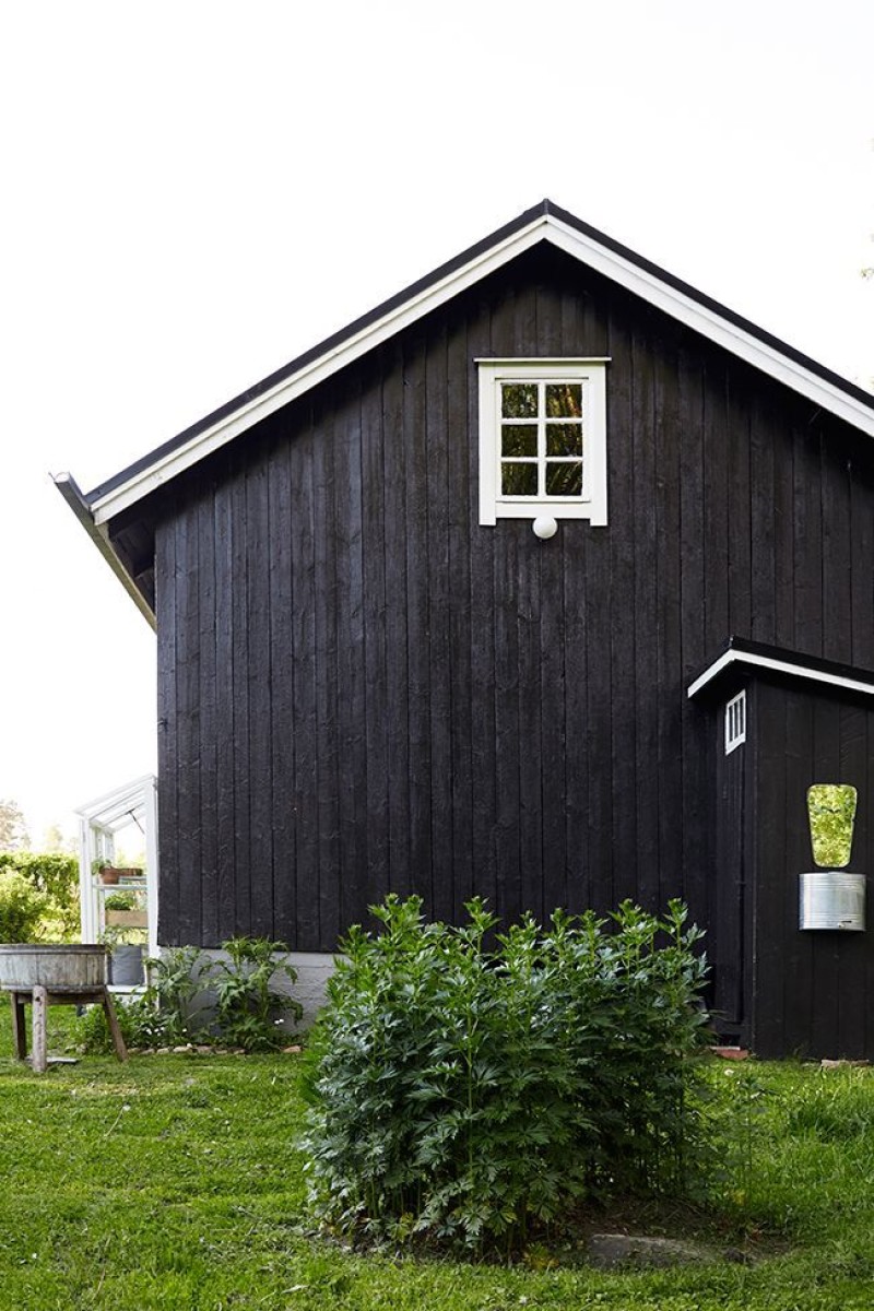 Barn painted in black Tikkurila