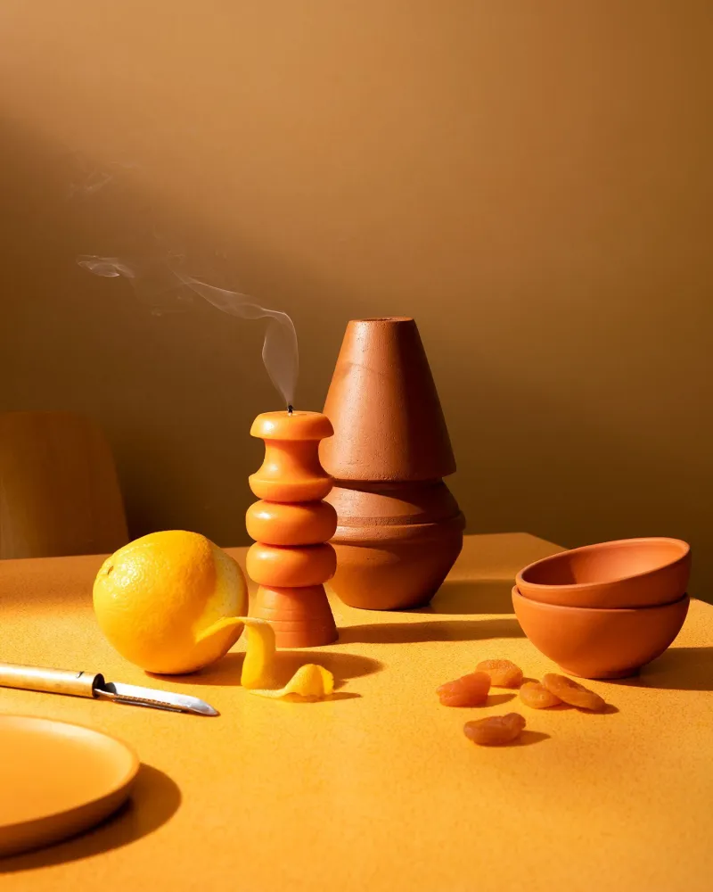 festival dinner table with warm orange yellow wall background