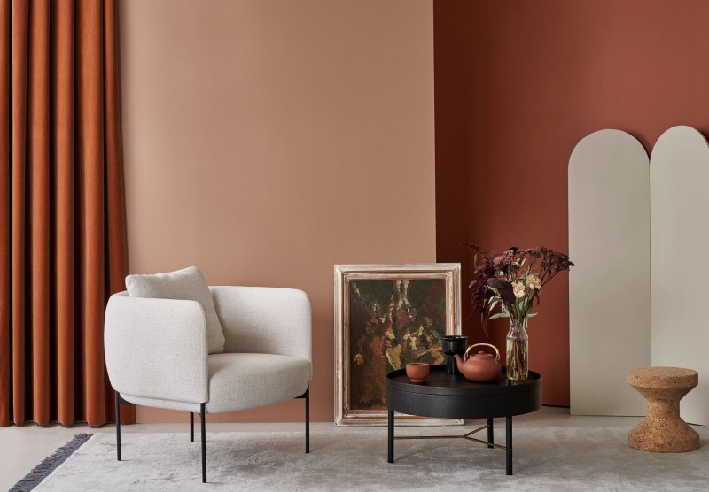 terracotta colour wall living room with beige colour furnitures