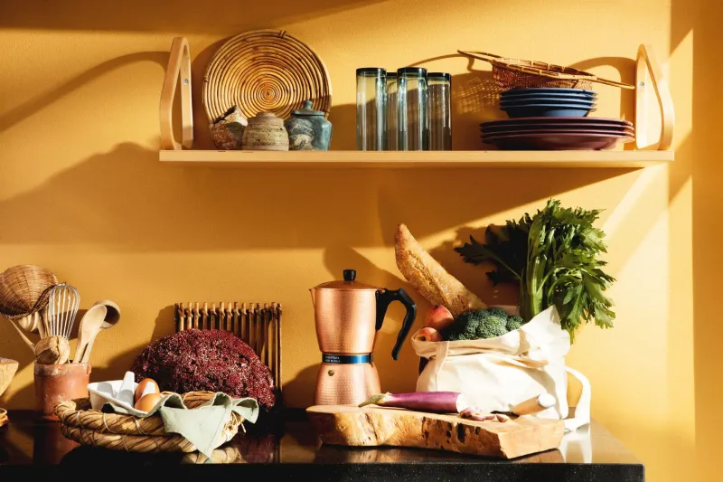 bright yellow kitchen with colourful tableware