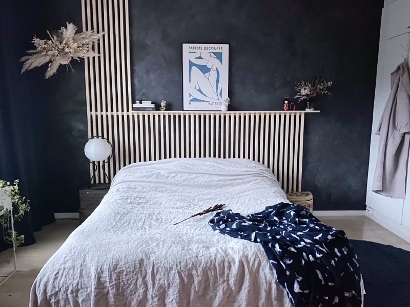 bedroom with blue colour wall and natural material decorations