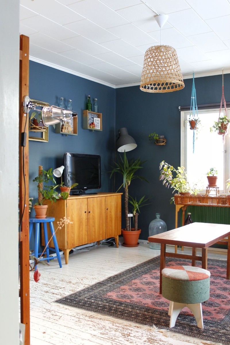 blue walls in living decorated with wooden furniture